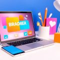 Birou modern cu laptop și elemente de branding vibrant.